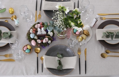 Photo of Beautiful Easter table setting with festive decor, flat lay
