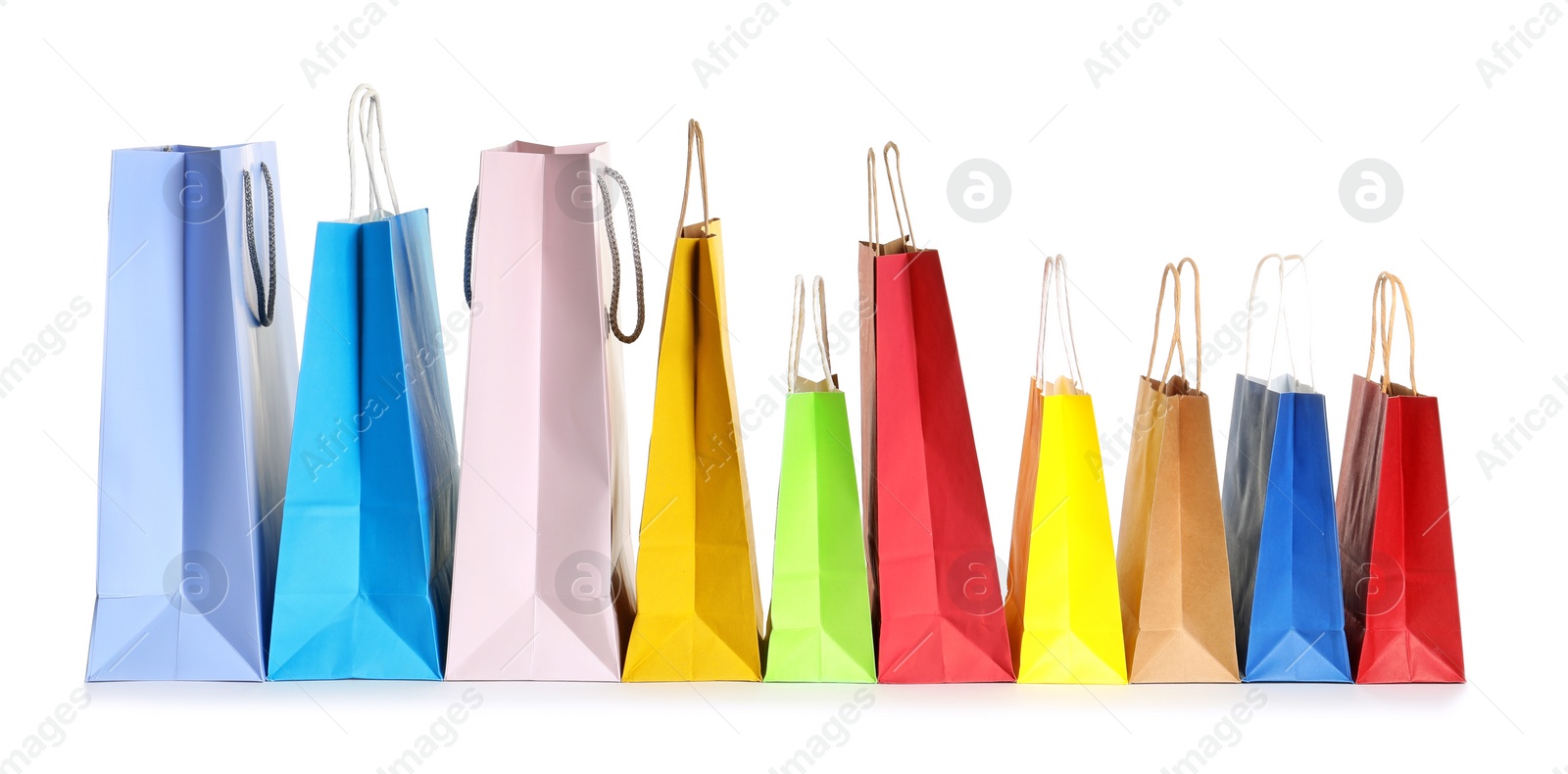 Photo of Colorful paper shopping bags on white background