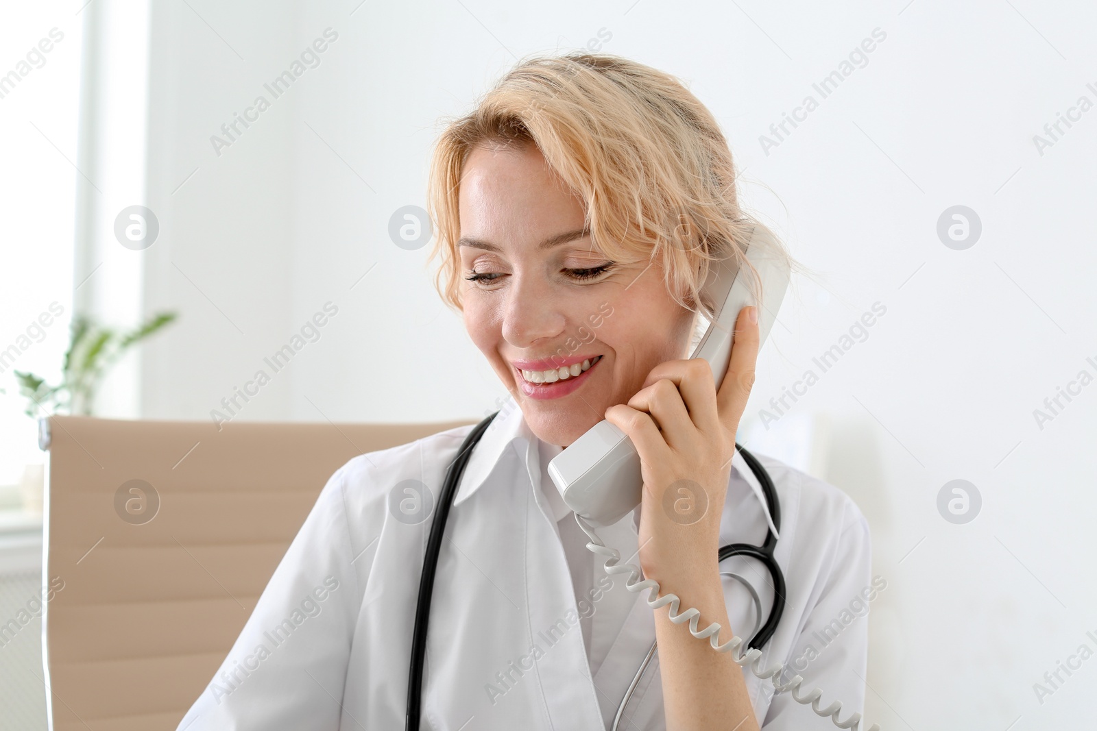 Photo of Female medical assistant working in clinic. Health care service