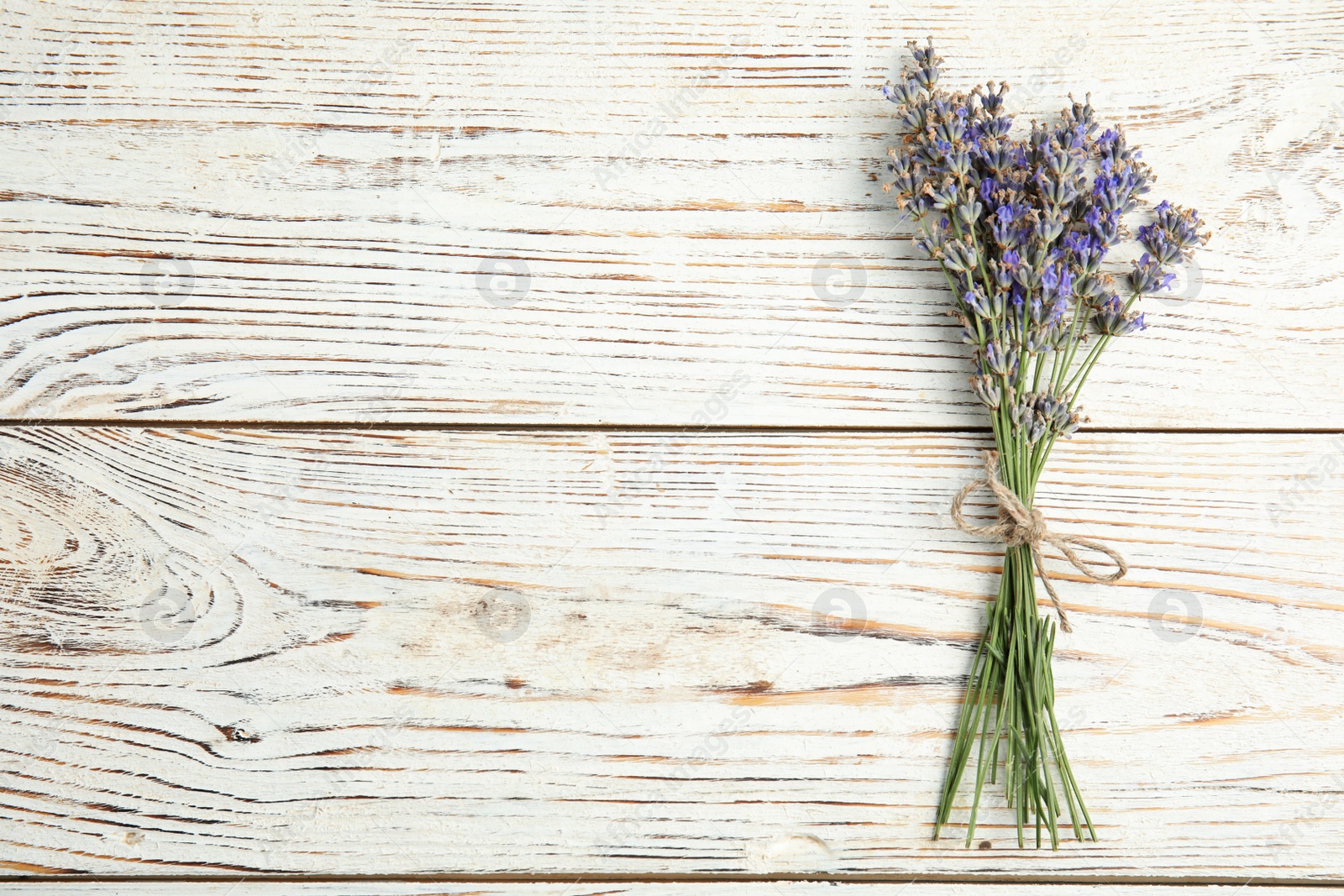 Photo of Blooming lavender flowers on wooden background, top view