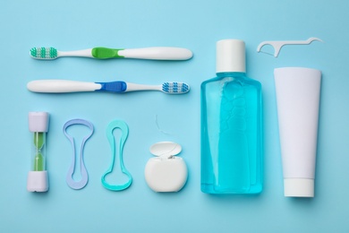 Flat lay composition with tongue cleaner on color background