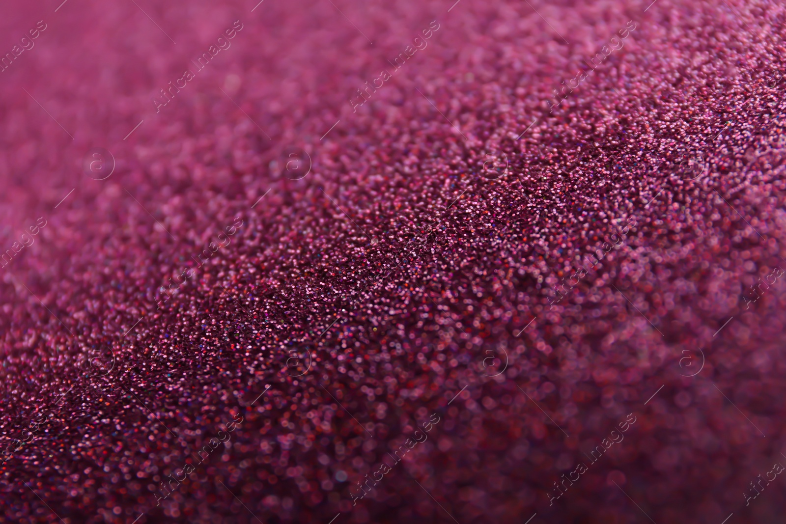 Photo of Closeup view of sparkling violet glitter background