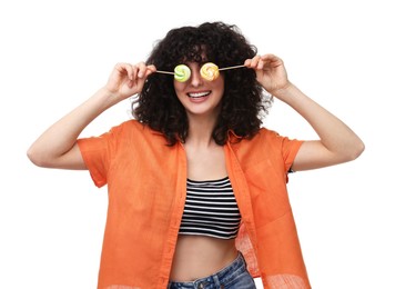 Beautiful woman covering eyes with lollipops on white background