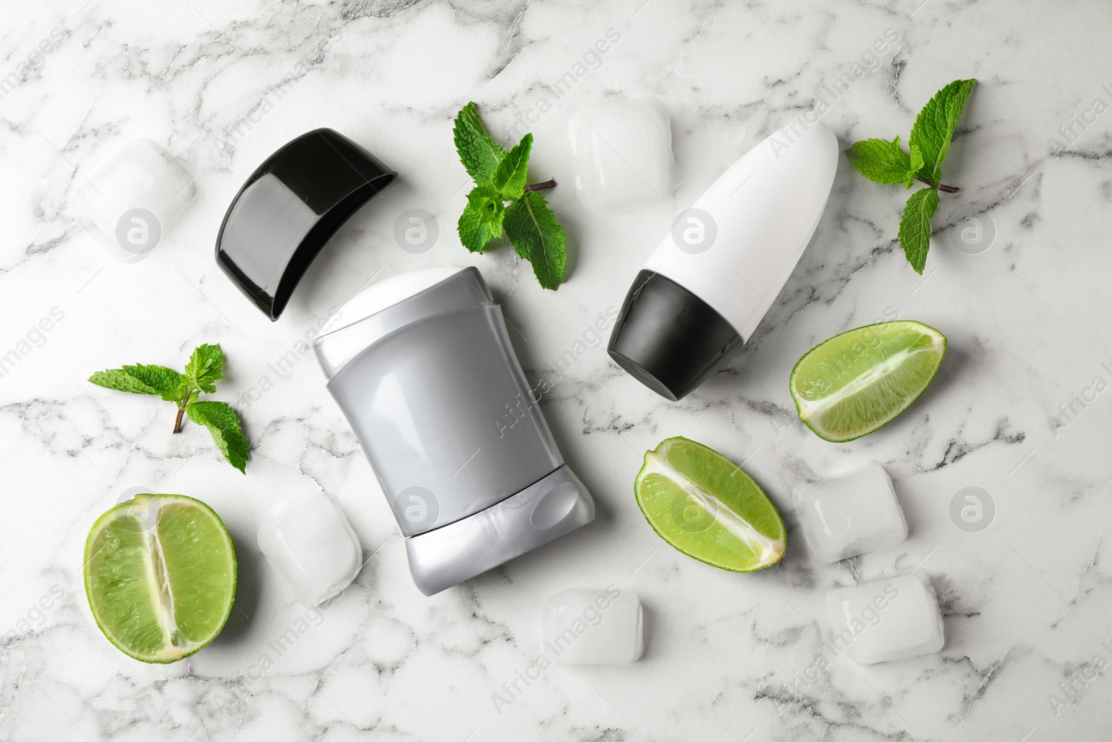 Photo of Flat lay composition with natural deodorants on white marble table