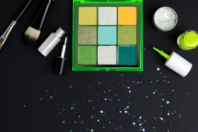 Photo of Setmakeup products on black background, flat lay
