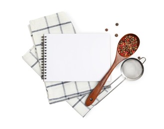 Photo of Blank recipe book, spices, napkin and kitchen utensils on white background, top view. Space for text