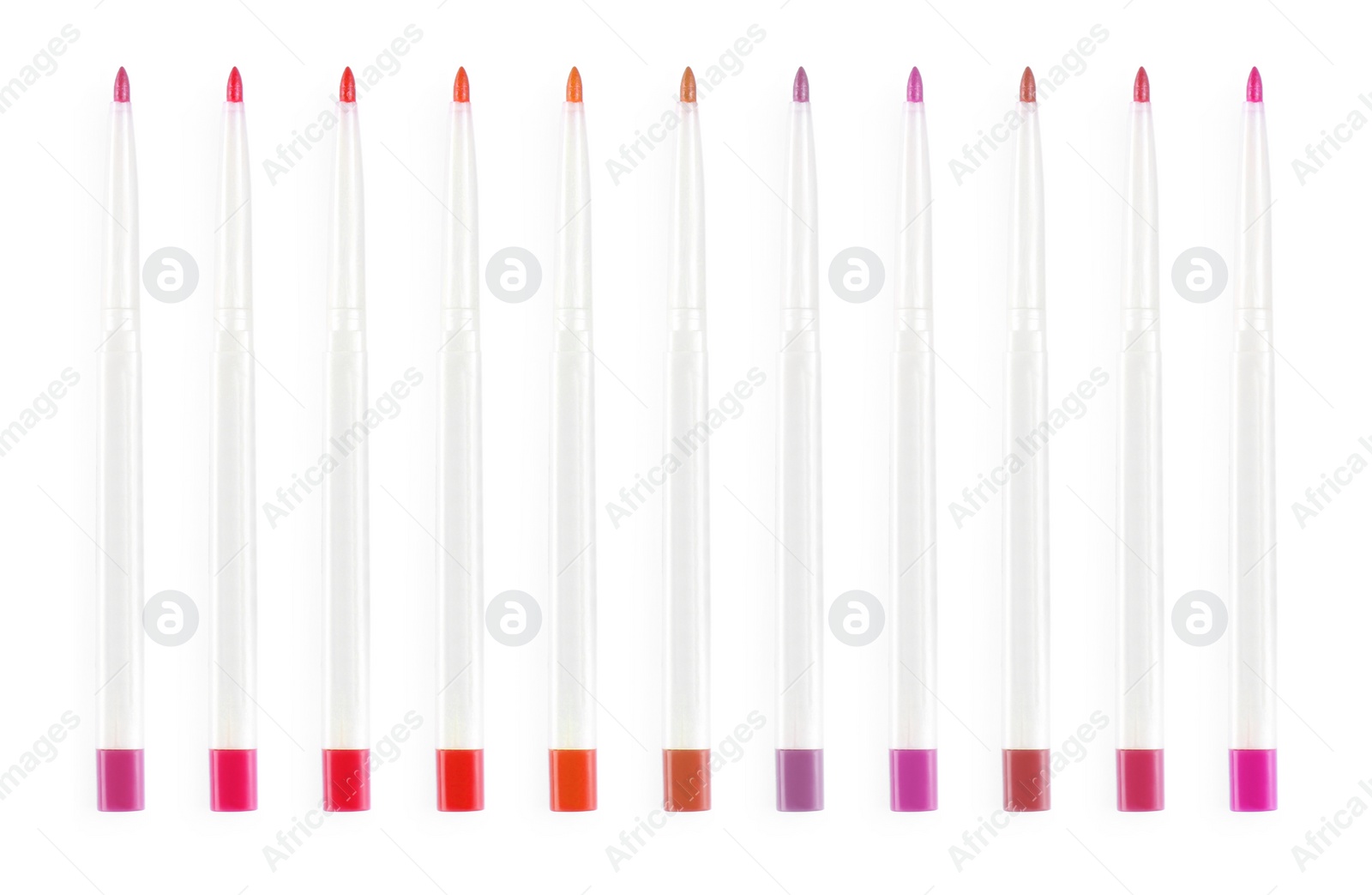 Image of Set with lip pencils of different shades on white background. Decorative cosmetics