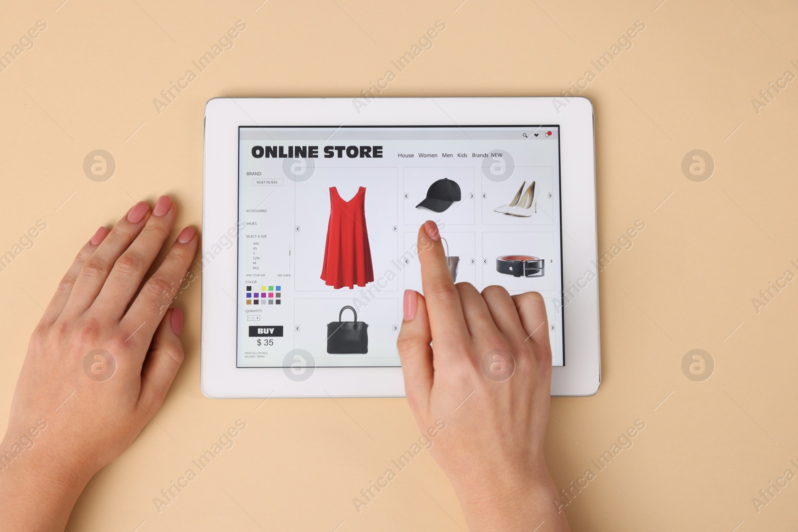 Photo of Woman with tablet shopping online on beige background, top view