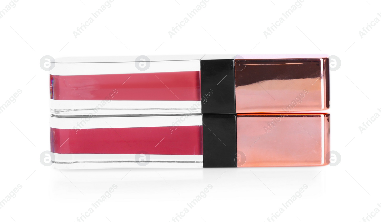 Photo of Two lip glosses isolated on white. Cosmetic products
