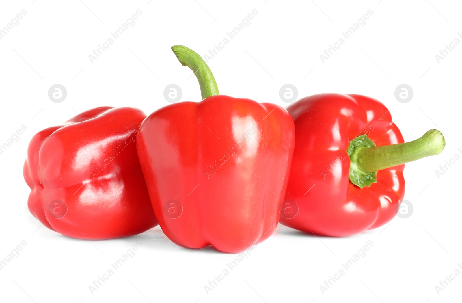 Photo of Tasty ripe red bell peppers on white background