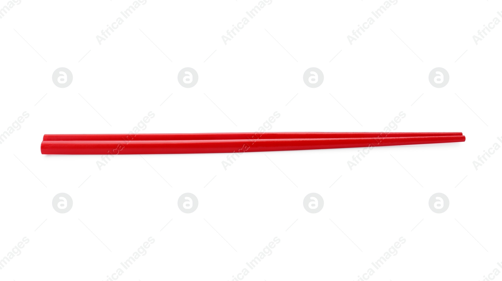 Photo of Pair of red chopsticks isolated on white