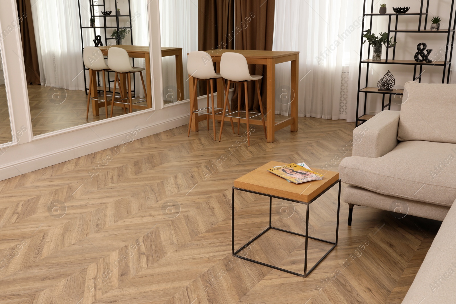 Photo of Modern living room with parquet flooring and stylish furniture