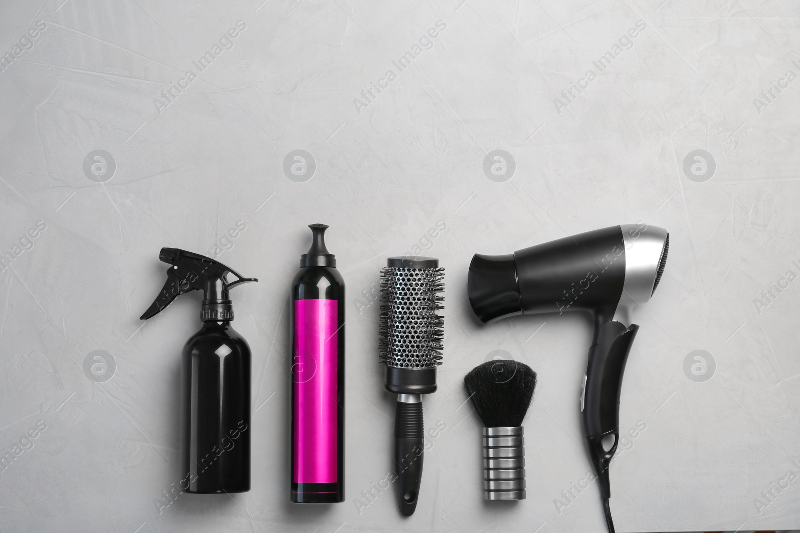 Photo of Professional hairdresser set on grey background