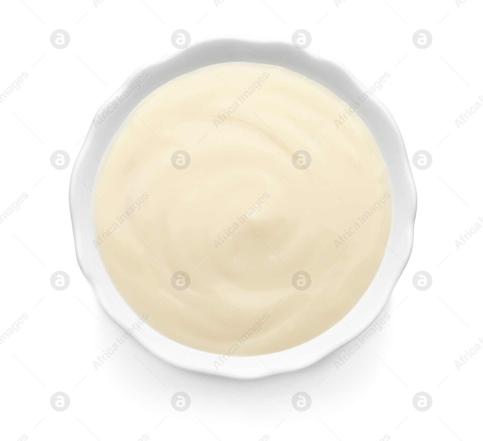 Photo of Bowl with vanilla pudding on white background