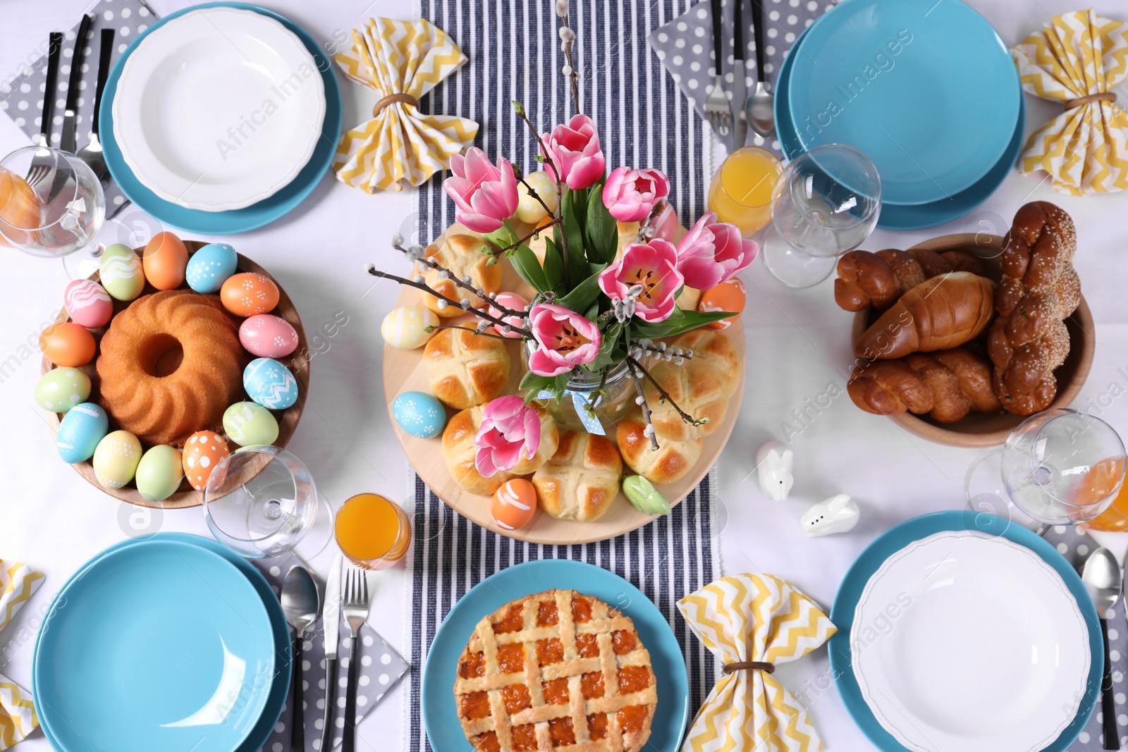 Photo of Festive Easter table setting with traditional meal, top view