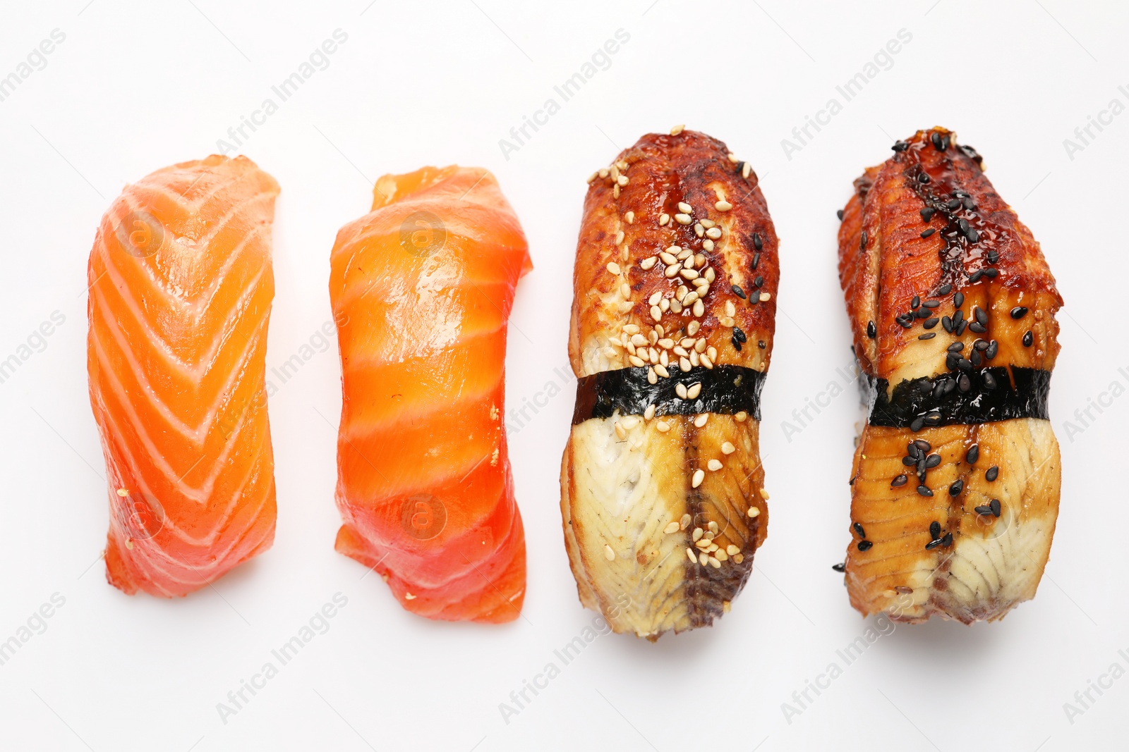 Photo of Delicious nigiri sushi on white background, flat lay