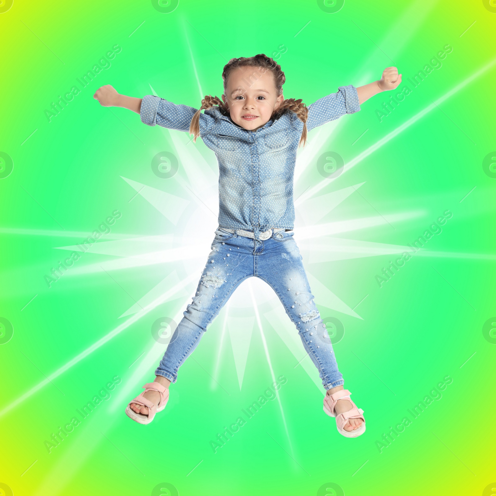 Image of Cute little girl jumping on colorful background. School holidays