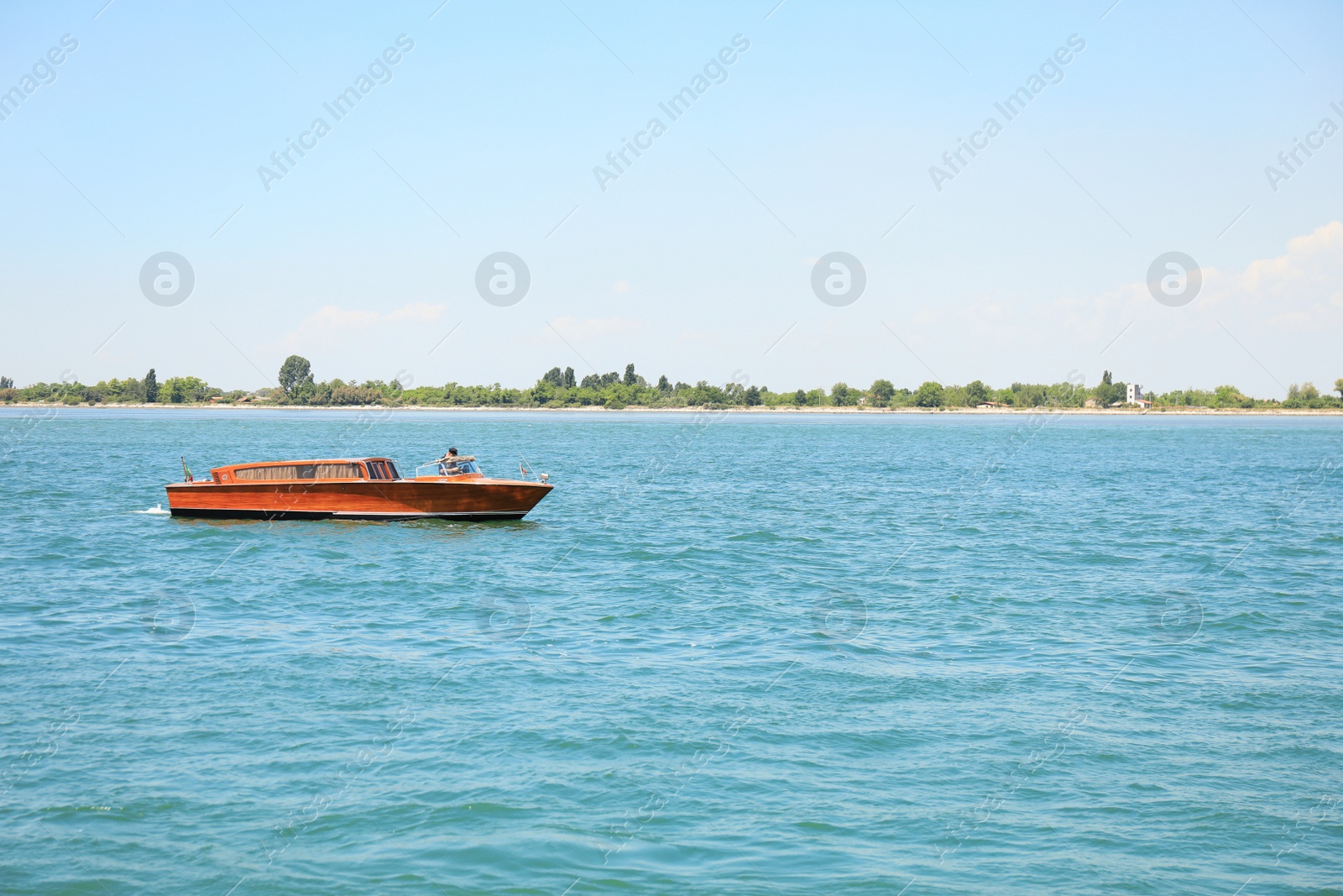 Photo of VENICE, ITALY - JUNE 13, 2019: Picturesque seascape with launch boat