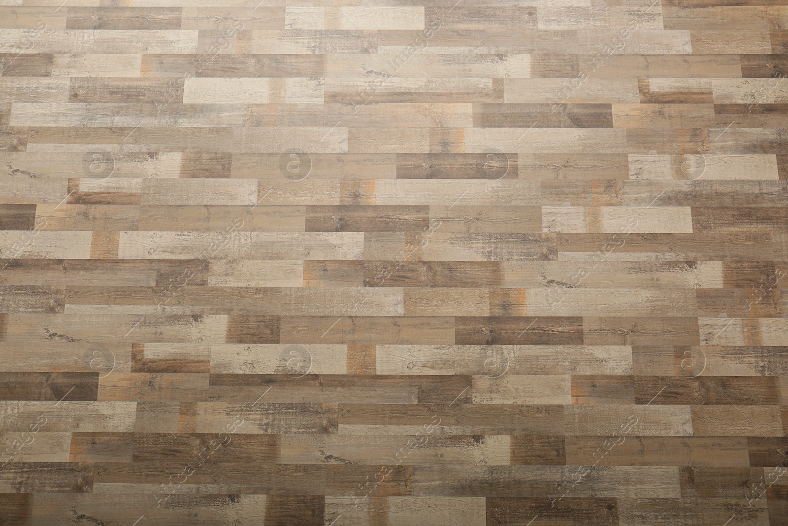 Photo of Wooden laminate as background, top view. Floor covering