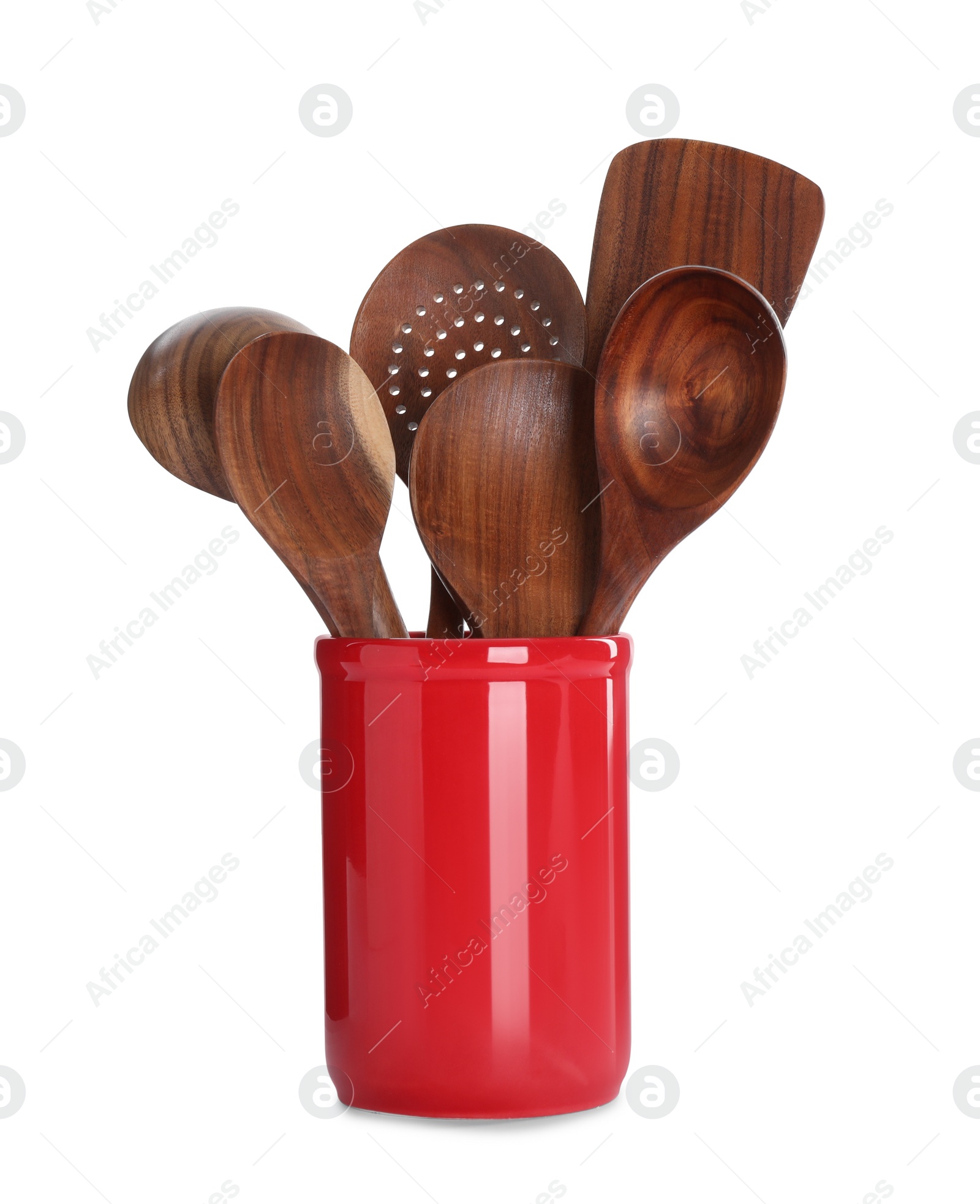 Photo of Set of wooden kitchen utensils in red holder isolated on white