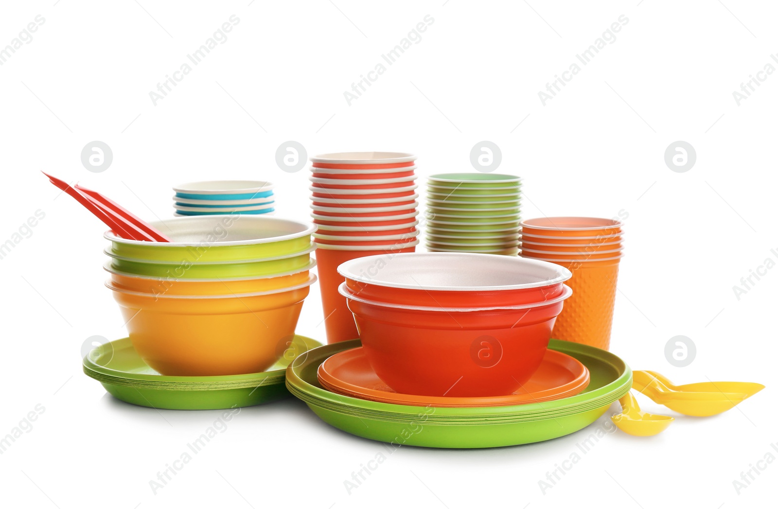 Photo of New plastic dishware on white background. Table setting