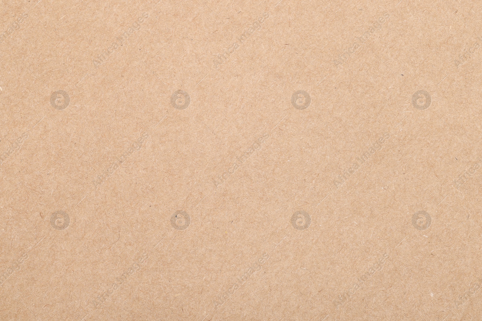 Photo of Texture of beige paper sheet as background, top view