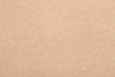 Texture of beige paper sheet as background, top view