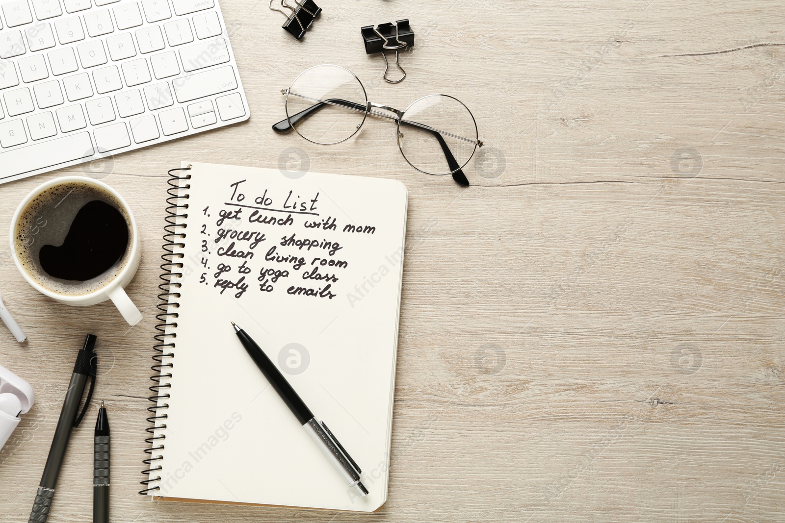 Photo of Flat lay composition with to do list on wooden table, space for text