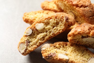Photo of Traditional Italian almond biscuits (Cantucci) on light table, closeup