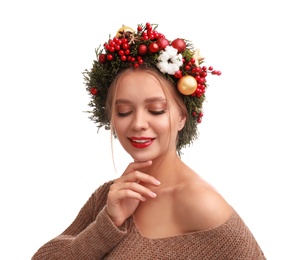 Photo of Beautiful young woman wearing Christmas wreath on white background