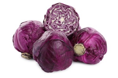 Whole and cut red cabbages on white background