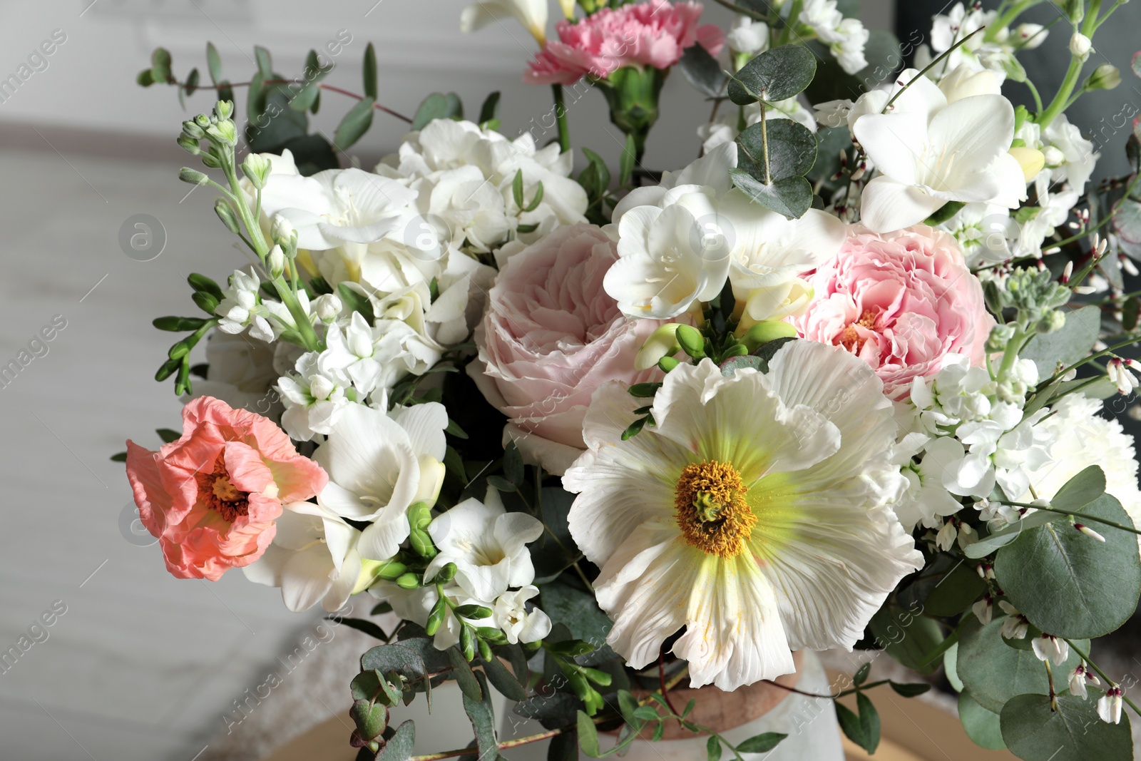 Photo of Bouquet of different beautiful flowers indoors, closeup