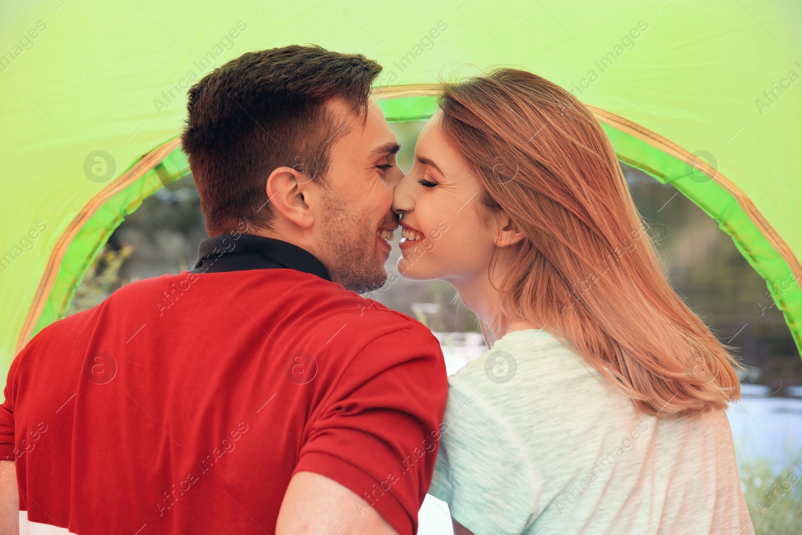 Photo of Cute young couple together in camping tent