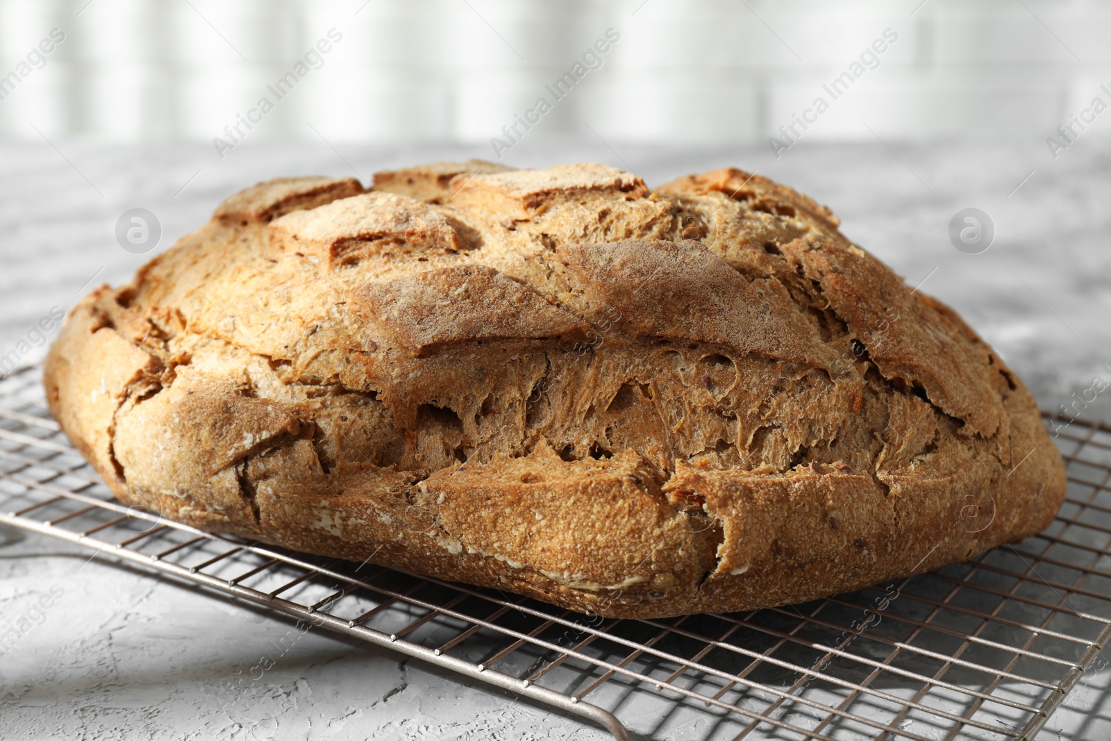 Photo of Freshly baked sourdough bread on grey table