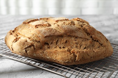 Freshly baked sourdough bread on grey table