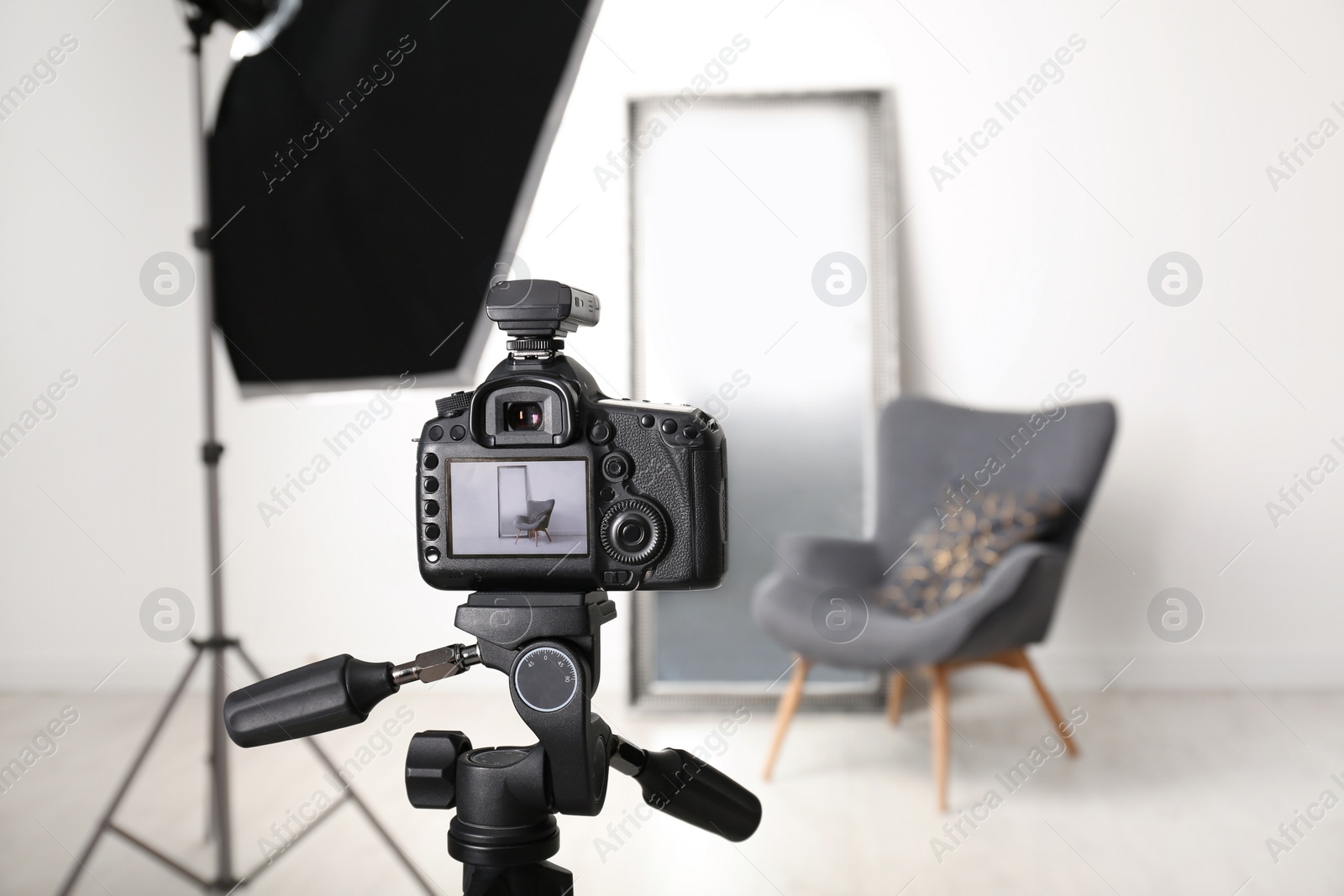 Photo of Interior of modern photo studio with professional equipment