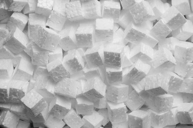 Photo of Polystyrene styrofoam pieces for packaging as background, top view