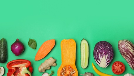 Flat lay composition with fresh ripe vegetables on color background. Space for text