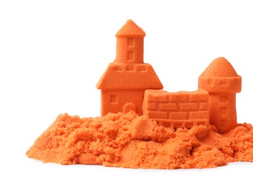 Castle figures made of orange kinetic sand isolated on white