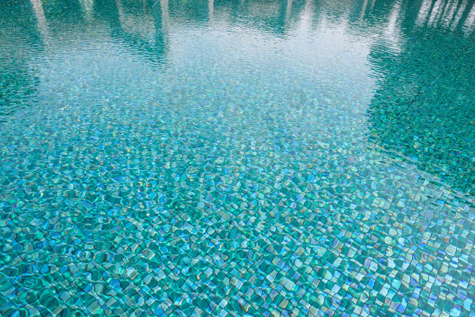 Photo of Clear water with ripples in swimming pool outdoors