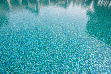 Clear water with ripples in swimming pool outdoors