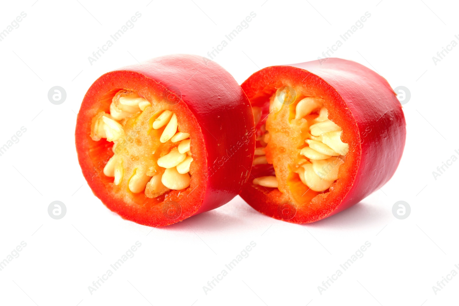 Photo of Slices of red chili pepper on white background