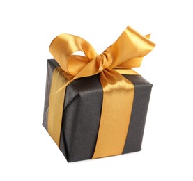 Beautiful gift box with golden ribbon and bow on white background