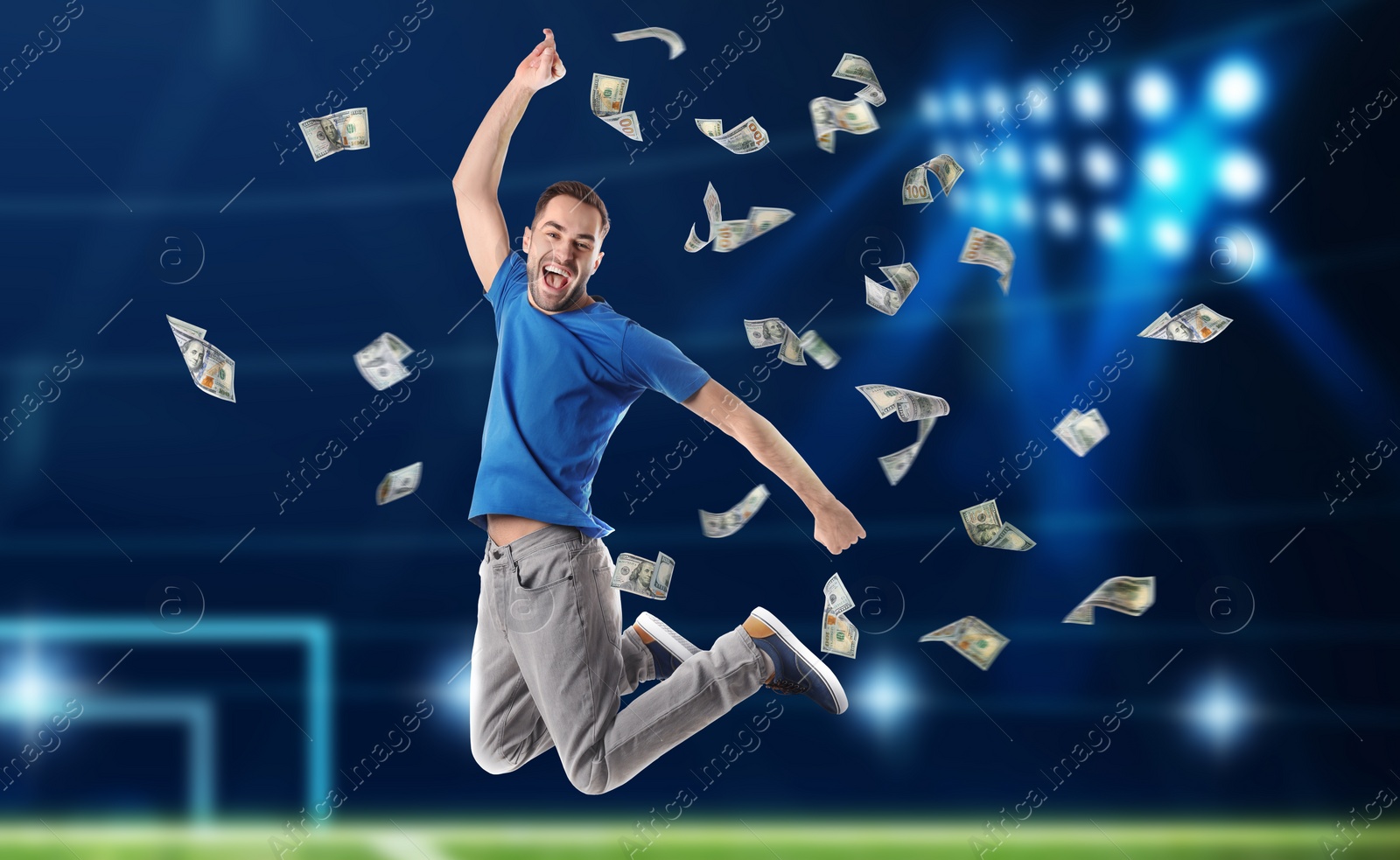 Image of Sports betting. Happy man jumping under money shower. Stadium on background