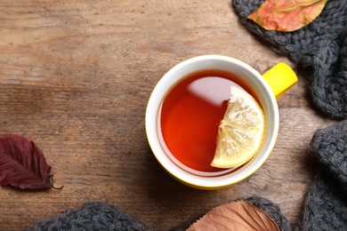 Flat lay composition with hot drink on wooden background, space for text. Cozy autumn