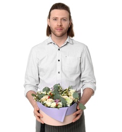 Male florist holding box with flowers on white background