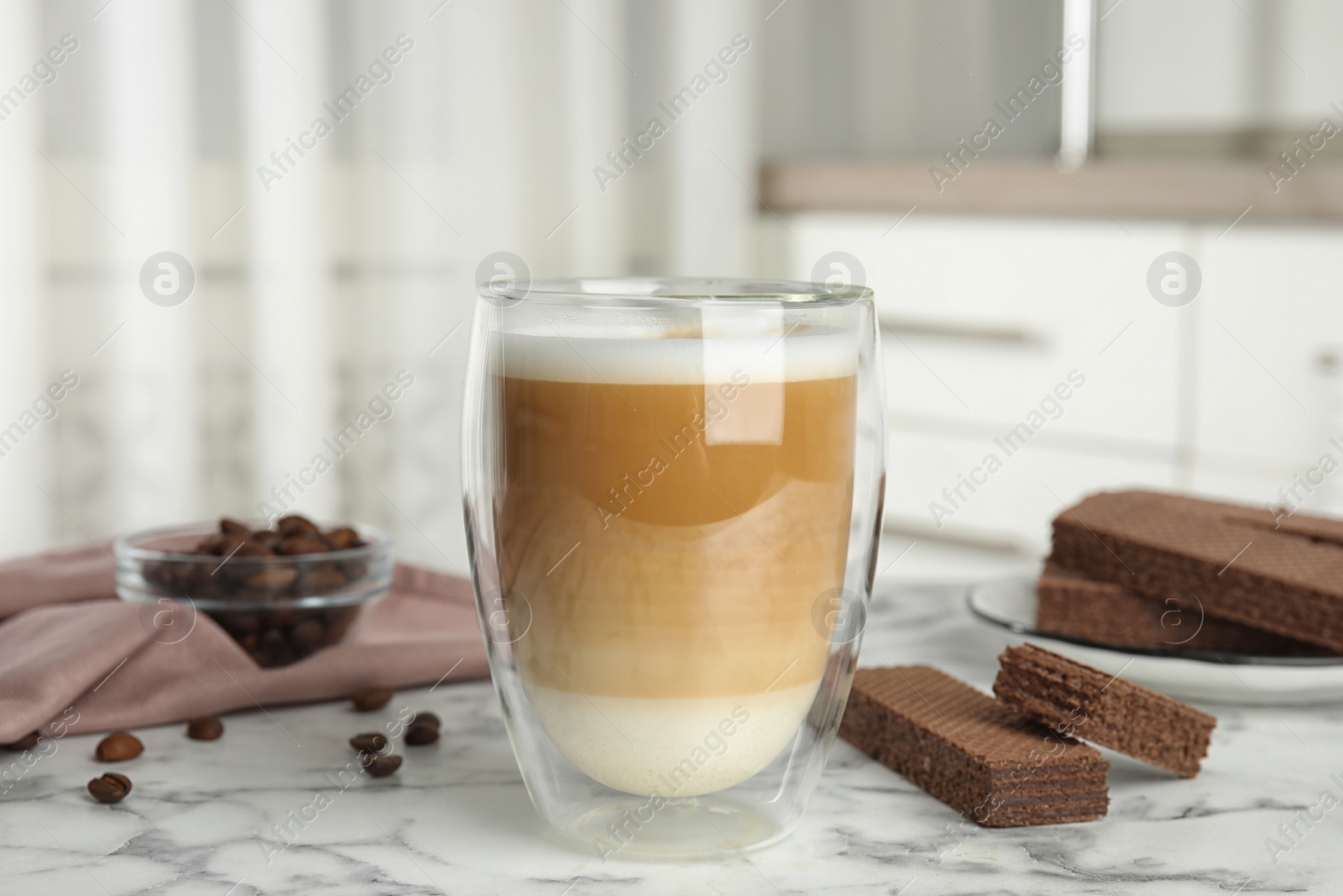 Photo of Delicious wafers and coffee for breakfast on white marble table