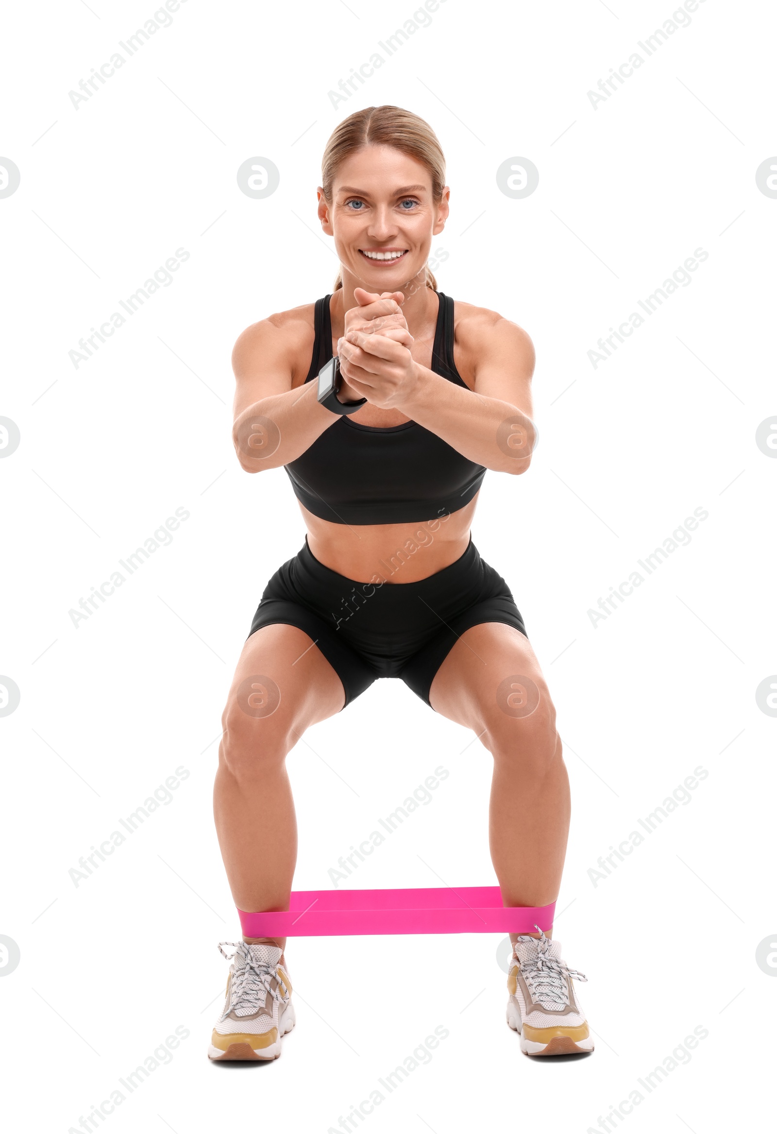 Photo of Woman exercising with elastic resistance band on white background