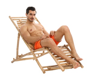 Photo of Young man on sun lounger against white background. Beach accessories