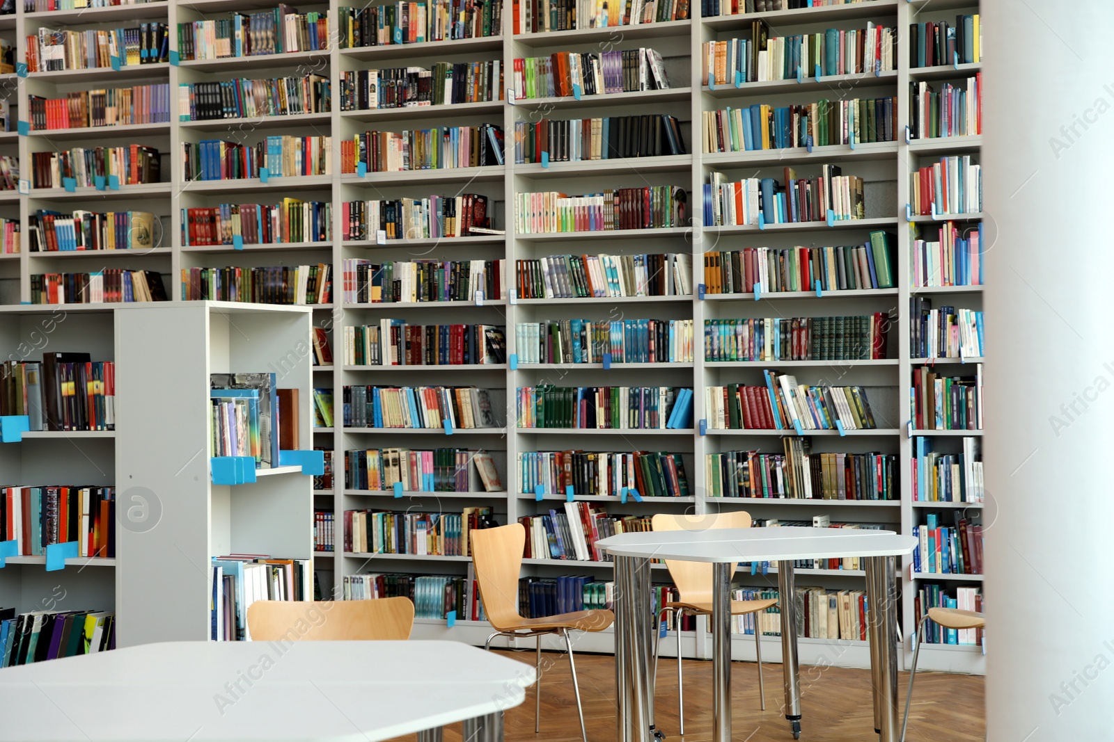 Photo of View of bookshelves and tables in library